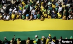 Demonstrators attend a protest against Brazil's President Dilma Rousseff, part of nationwide protests calling for her impeachment, in Copacabana in Rio de Janeiro, Brazil, Aug. 16, 2015.