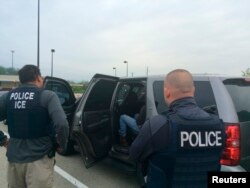 FILE - Officers from U.S. Immigration and Customs Enforcement's Enforcement and Removal Operations unit are shown during an operation targeting criminal aliens and other immigration violators in Philadelphia, in this image released May 11, 2016.