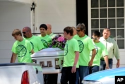 These children in Florida wearing anti-bullying t-shirts carry the casket of their classmate, Rebecca Sedwick. In 2013 at age 12, she jumped to her death after being bullied online.