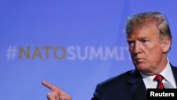 U.S. President Donald Trump gestures at his press conference after the NATO Summit in Brussels, Belgium, July 12, 2018.