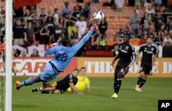 FILE -- DC United goalkeeper Bilal "Bill" Hamid (28) reaches for the ball during a MLS game.