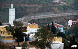 A picture shows a general view of the fence between the Moroccan city of Fnideq and the tiny Spanish enclave of Ceuta, Feb. 17, 2017.