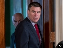 FILE - White House Communications Director Mike Dubke arrives in the East Room of the White House in Washington, April 20, 2017.