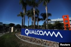FILE - A sign on the Qualcomm campus is seen in San Diego, California, Nov. 6, 2017.