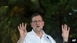 FILE - Spain's acting Prime Minister and Popular Party candidate, Mariano Rajoy speaks in Seville, Spain, June 23, 2016. 