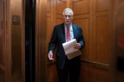 Sen. Angus King, I-Maine, departs the Senate following defense arguments by the Republicans in the impeachment trial of President Donald Trump on charges of abuse of power and obstruction of Congress, Jan. 25, 2020.