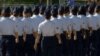 In this June 22, 2012, image taken from video, female airmen march during graduation at Lackland Air Force Base in San Antonio, Texas..