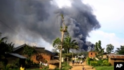 Smoke rises from the United Nations compound in Beni, Democratic Republic of Congo, Nov. 25, 2019.