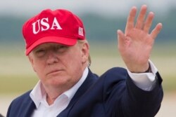 FILE - President Donald Trump waves as he steps off Air Force One after arriving at Andrews Air Force Base, Maryland, June 7, 2019.
