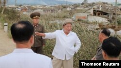 North Korea's leader Kim inspects area after typhoon Maisak.