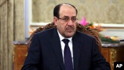 FILE - Iraqi Prime Minister Nouri al-Maliki, shown here, has met with Iranian Gen. Ghasem Soleimani.