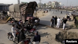 Supporters of a religious political party block a road to protest against the execution of Mumtaz Qadri, in Rawalpindi, Pakistan, Feb. 29, 2016.