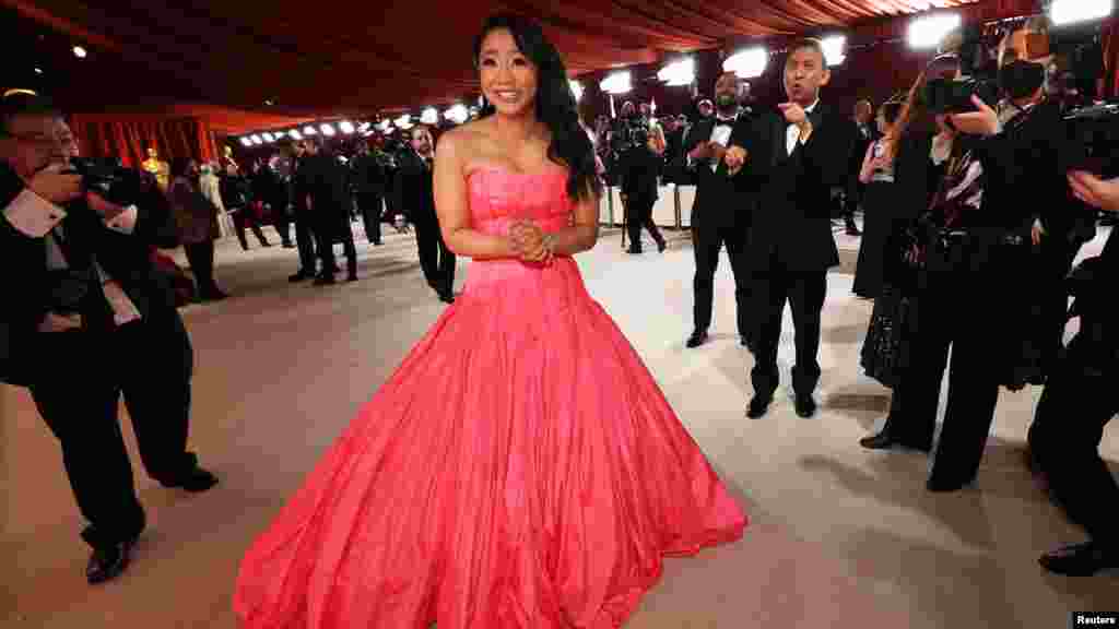 Stephanie Hsu poses on the champagne-colored red carpet during the Oscars arrivals at the 95th Academy Awards in Los Angeles, March 12, 2023. (Photo by Mario Anzuoni/Reuters)