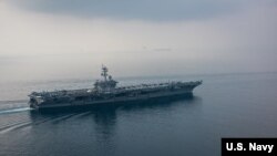 The aircraft carrier USS Carl Vinson (CVN 70) transits the Sunda Strait. The Carl Vinson Carrier Strike Group is on a regularly scheduled Western Pacific deployment.
