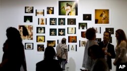 People attend the ArtRio International Art Fair in Rio de Janeiro, Brazil, Sept. 9, 2015. 