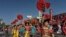 Dancers participate in the Chinatown's 119th annual Golden Dragon Parade to celebrate the Year of the Dog, with firecrackers, dragon, floats and bands in Los Angeles, Feb. 17, 2018. 
