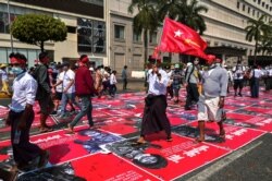Demonstrators protest against military coup in Yangon, Feb. 22, 2021.