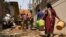 Residents arrive to fill their containers with drinking water from a tanker in a neighborhood that is facing severe water scarcity in Bengaluru, India, March 11, 2024. The U.N. marks World Water Day on March 22 and warns of the growing risk of conflict over scarce water.