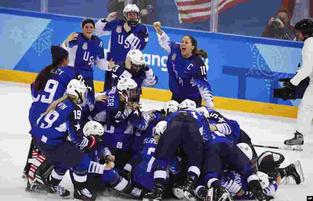 United States celebrates winning the women's gold medal hockey game against Canada at the 2018 Winter Olympics in Gangneung, South Korea, Feb. 22, 2018.