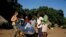 Crosby Menzies shows one of his SunFire solar cookers to villagers in Zambia (SunFire)