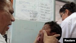 FILE - A dengue fever victim receives medical treatment at a health center in Managua, Oct. 31, 2013. Hemorrhagic dengue was responsible for 14 deaths in Nicaragua so far this year, with the number of cases confirmed at more than five thousand, according 