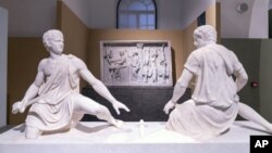 In this undated photo made available Monday, Oct. 12, 2020, ancient Greek and Roman marble statues are seen prior to going on display in the newly refurbished Villa Caffarelli. (Fondazione Torlonia via AP)