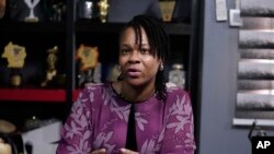 Ebunola Akinwale, the owner of Nature's Treat Cafe, speaks with The Associated Press in Ibadan, Nigeria, May 27, 2024. Small businesses either close shop or continue with alternative power generation, incurring high costs that hurt their capacity for expansion.