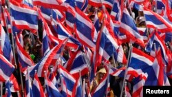 A man slides down a snow-covered hill in the northwest of Washington, D.C. Some 4 to 6 inches (10 to 15 cm) of snow fell in the city overnight. Schools and government offices closed Tuesday.