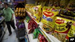 Packaged food with "Maggi" sign on it are displayed at a grocery store in Bangalore, India, June 5, 2015. 