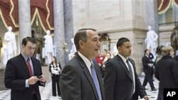 House Speaker John Boehner of Ohio walks through Statuary Hall on Capitol Hill in Washington, Jan 6, 2011