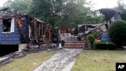 A damaged house on Jefferson Street, in Lawrence, Mass., is seen, Sept. 14, 2018. 