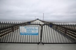 A pier is fenced off in Newport Beach, Calif., April 30, 2020.