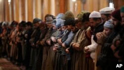 Kashmiri Muslims offer prayer inside Jamia Masjid in Srinagar, Indian controlled Kashmir, Dec. 18, 2019. 