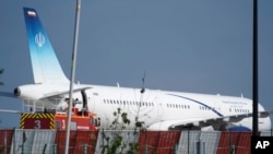 An Iranian plane can be seen at the airport in Biarritz, France Sunday, Aug. 25, 2019. 