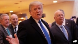 Visitors gather during a presentation visit of the &quot;Grand Palais Ephemere&quot;, with the Eiffel Tower seeing outside, in Paris, France.