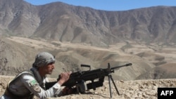 FILE - An Afghan security forces member takes part in a military operation in Jurm district, Badakhshan province, Afghanistan, March 31, 2018.