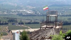 An Iranian flag flies above a hilltop park overlooking Israel, 02 Sep 2010. The garden was a gift from Tehran to the people of South Lebanon.