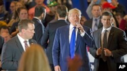 Republican presidential candidate Donald Trump walks through the buffer as he mixes with supporters mid-speech during a campaign stop at the Savannah Center, March 13, 2016, in West Chester, Ohio. 
