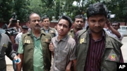 Members of Bangladesh Police Detective Branch escort Sumon Hossain Patwari in Dhaka, Bangladesh, Thursday, June 16, 2016.