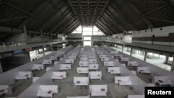 FILE - A general view of beds set up at the premises of the Expo Center, after the government turned it into a hospital following the outbreak of coronavirus disease (COVID-19), in Lahore, Pakistan, March 26, 2020. 