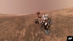 This composite image made from a series of Jan. 23, 2018 photos shows a self-portrait of NASA's Curiosity Mars rover on Vera Rubin Ridge. (NASA/JPL-Caltech/MSSS via AP)