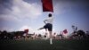 Students practice flag cheering routines at a Tokyo Korean junior and senior high school in Tokyo, Sept. 26, 2017. 