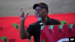 FILE - Economic Freedom Fighters opposition party leader Julius Malema addresses supporters and volunteers near Durban, South Africa, on Feb. 8. 2024. The fiery populist politician has been charged with hate speech and for firing a gun at a public rally.