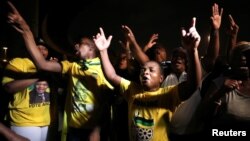 Supporters of former South African President Jacob Zuma hold a vigil before his court appearance in Durban, South Africa, April 5, 2018.