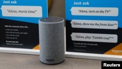 FILE - Prompts on how to use Amazon's Alexa are seen in an Amazon "experience center" in Vallejo, California, May 8, 2018. In an effort to counter possible sexist stereotypes, a team created a voice nicknamed Q that is designed to be perceived as neither male or female.