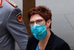 FILE - German Defense Minister Annegret Kramp-Karrenbauer arrives at a news conference on German armed forces Bundeswehr Special Forces Command (KSK) in Berlin, July 1, 2020.