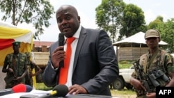 M23 rebel leader Bertrand Bisimwa (C) is seen in a March 7, 2013, file photo.