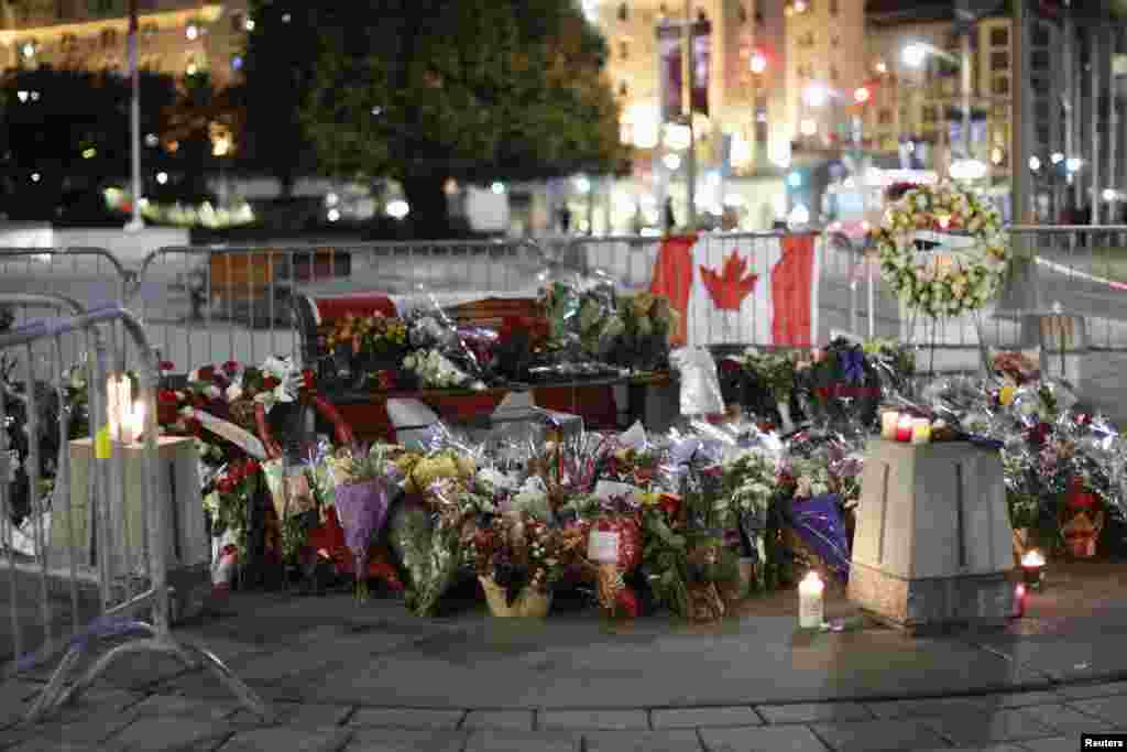 People laid flowers at the memorial for Cpl. Nathan Cirillo near the National War Memorial in downtown Ottawa, Oct. 23, 2014. 