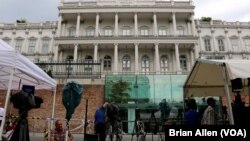 Journalists wait in front of Palais Coburg where closed-door nuclear talks with Iran take place in Vienna, Austria, July 7, 2015.
