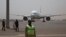FILE - A plane is seen parked at the airport in Bamako, Mali, March 5, 2021.